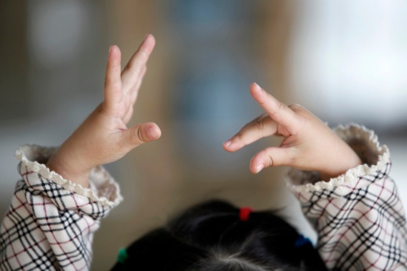 A three and three-month years old girl  practises ballet in Beijing